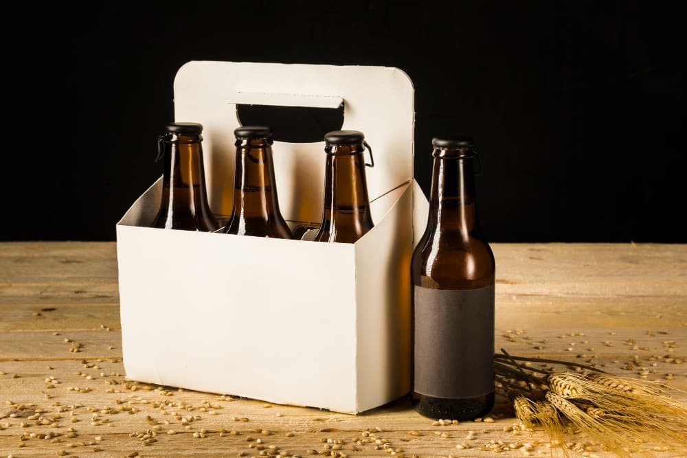 /beer-packaging/beer-bottle-carton-box-ears-wheat-wooden-surface.jpg