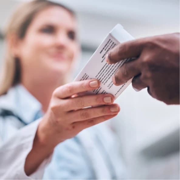 /images/packaging-solutions/biomedical-boxes/pharmacy-medication-box-and-pharmacist-helping.webp