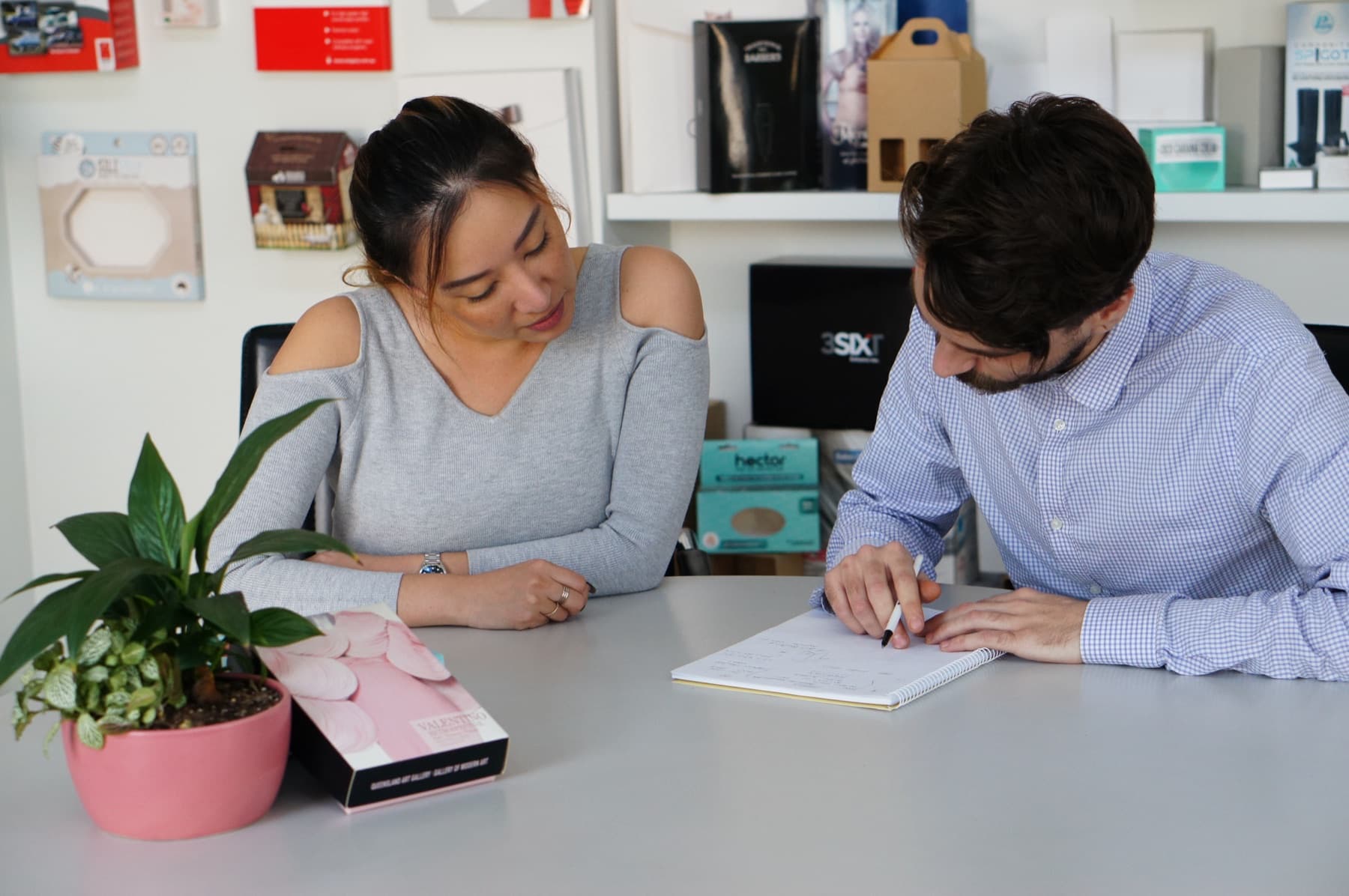 Pakko account team discussing a job with a customer